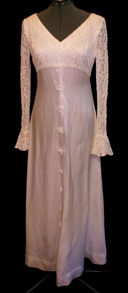 Pretty 60s empire waist wedding dress Features lace overlay on the bodice 