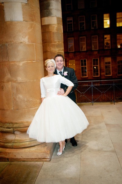 The couple chose a stunning blue Pontiac for wedding transport in true 50s