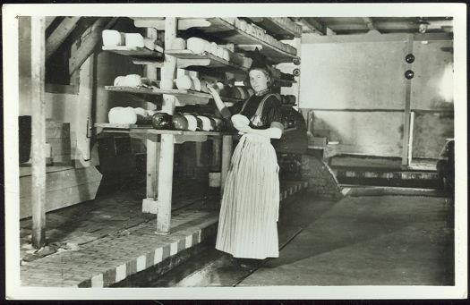 Image for REAL PHOTO POSTCARD OF YOUNG DUTCH LADY WITH CHEESE DRYCAFFOLD