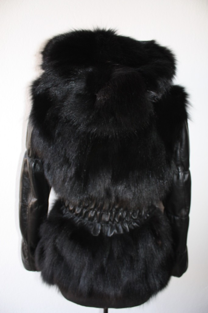 black fox fur jacket with hood , leather waist and sleeves rear view