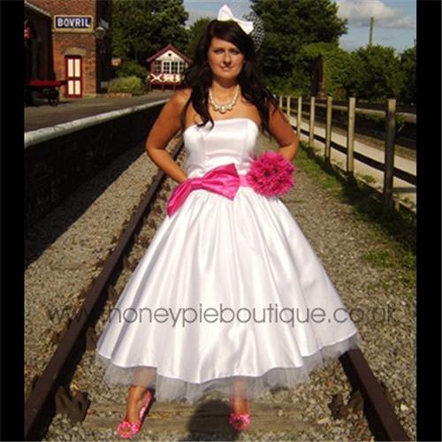 Stunning 1950s style wedding dress in white satin with lace up back