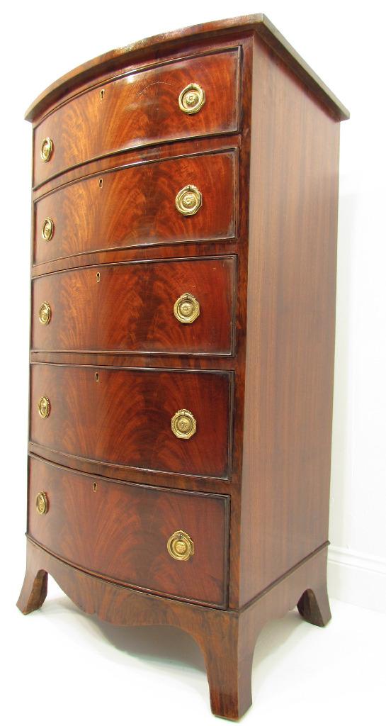 An Antique Tall and Narrow Flamed Bow Front Mahogany Chest Of drawers