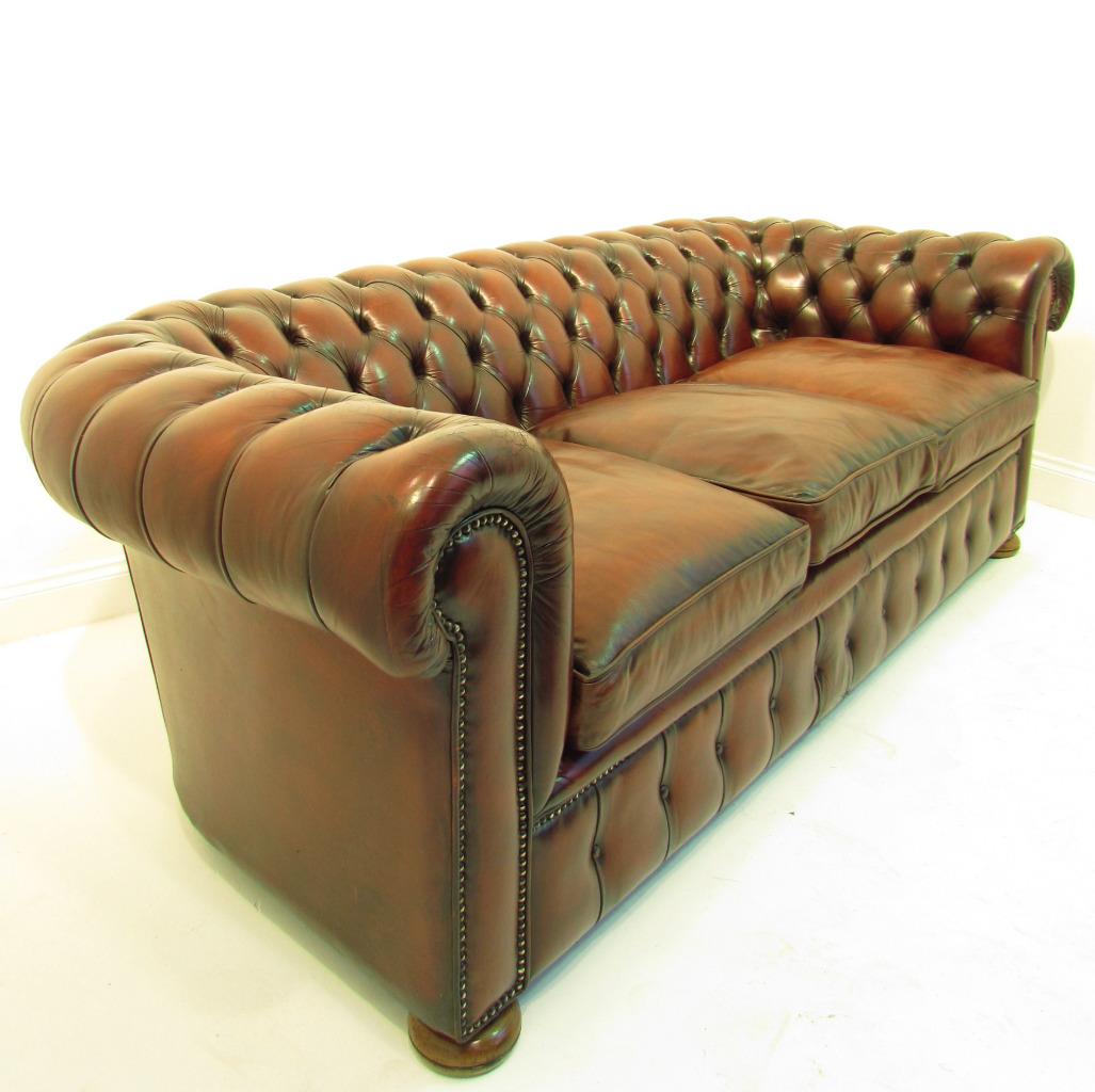 brown leather tufted with roll arms deep seated sofa 