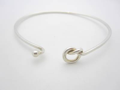 ... Tiffany  Co. Sterling Silver 18k White Gold Love Knot Bangle Bracelet