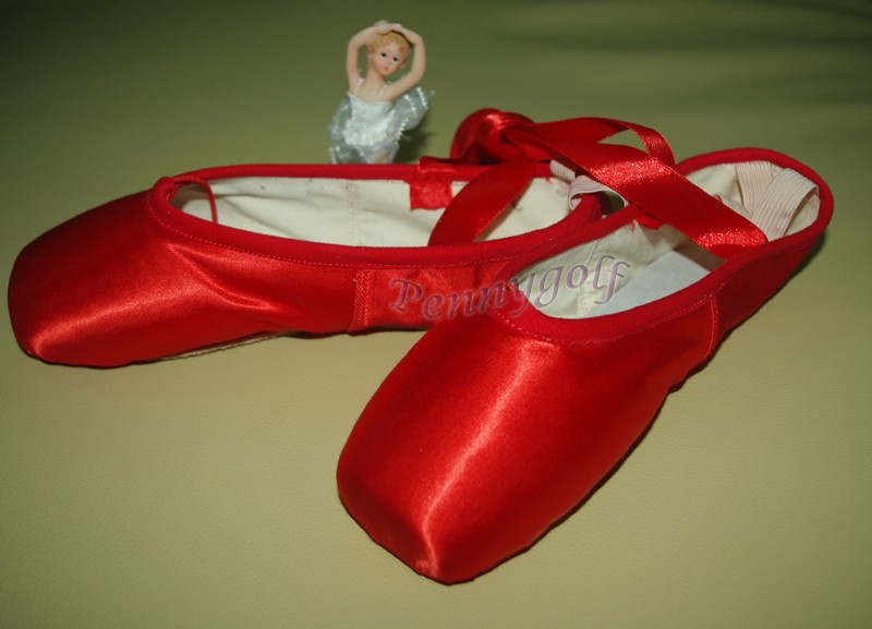 red ballet shoes with ribbons