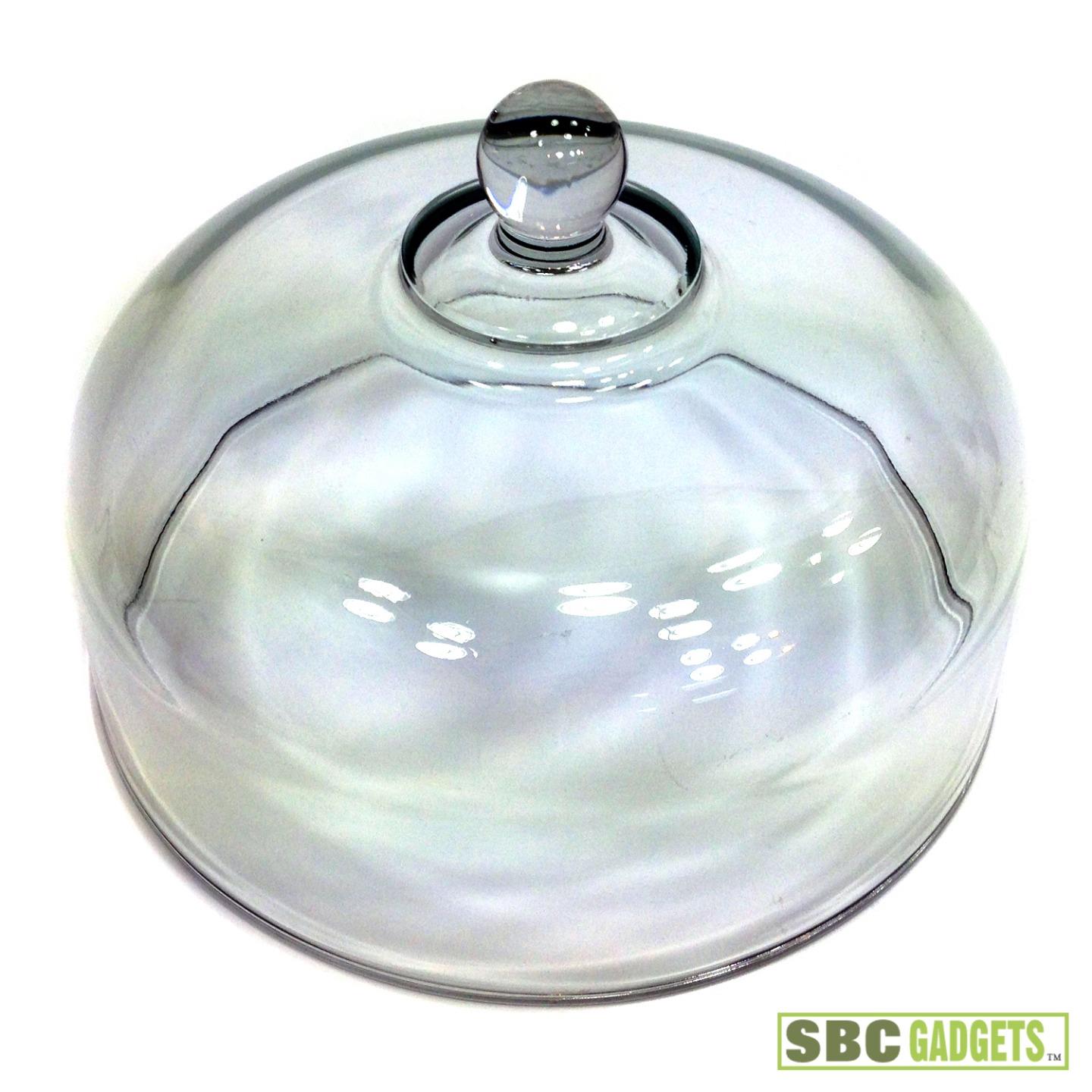 Glass dome cover The Cake Stand with Dome Cover from Fratelli Guzzini lets you serve your favorite desserts with flair. This clear acrylic stand has a unique undulating design and the appearance of glass, while the domed cover keeps your desserts fresh and appealing.