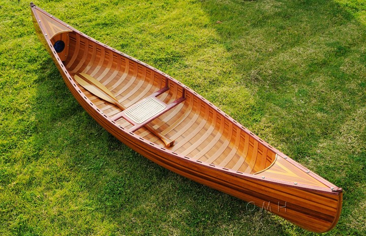 This display canoe measures 118.5" long from bow (front) to stern 