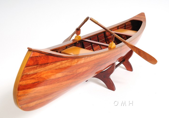 Included with this model is a set of wooden paddles and a wood stand 