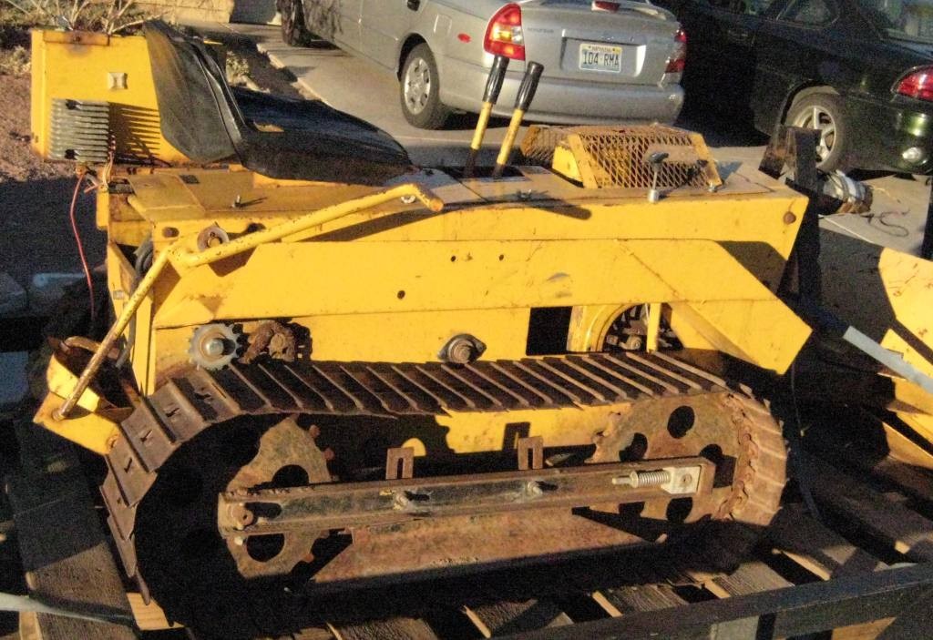 Its an old Struck MD1600 mini-dozer. It'll do anything a big dozer will do, 
