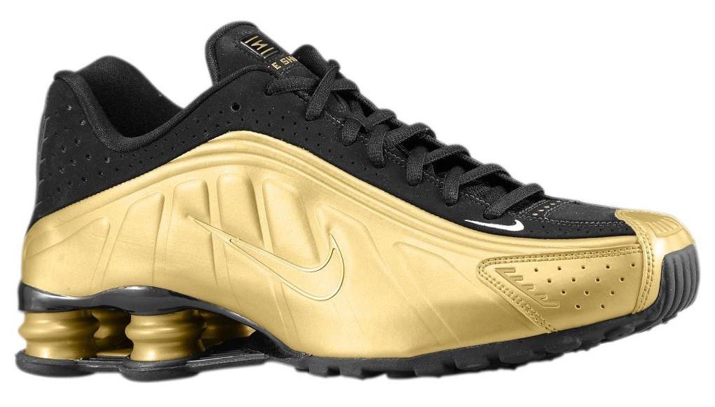 gold and black nike shox