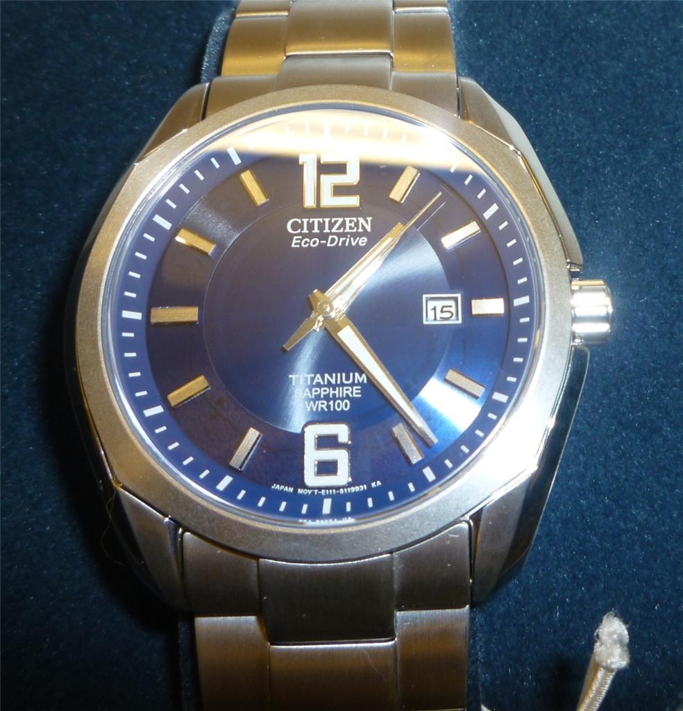 citizen silver watch with blue face