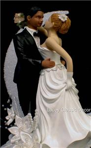Black groom and white bride wedding cake toppers