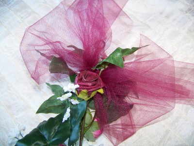 The flowers include a selection of Burgundy and White Foam Roses The flowers include a selection of Burgundy and White Foam Roses