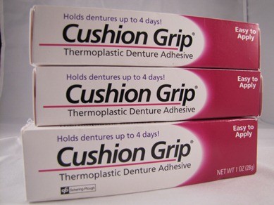 How do you apply cushion grip to dentures?