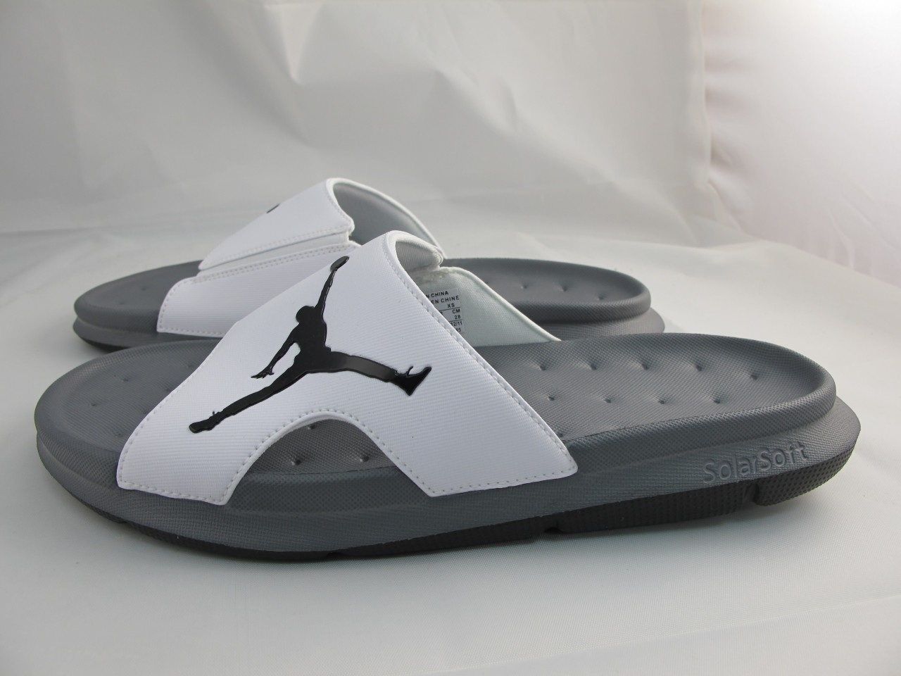 grey and white jordan slides