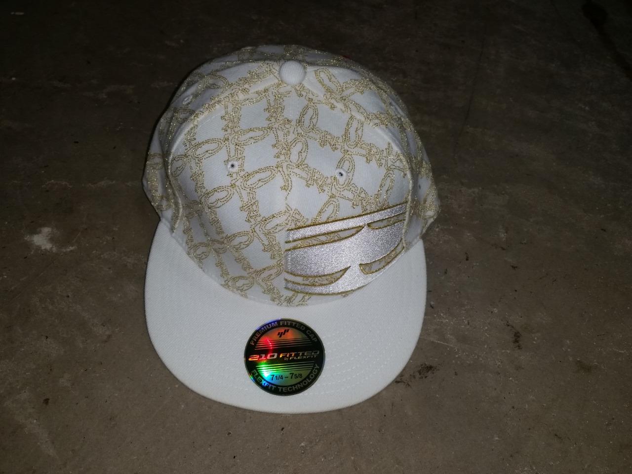 white and gold fitted hat
