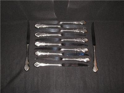 ONEIDA FOLK ART STAINLESS STEAK KNIVES - 12