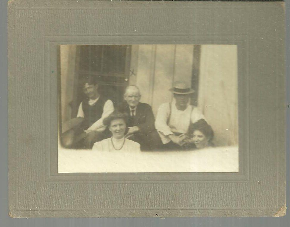 Image for FRAMED MOUNTED PHOTOGRAPH OF FAMILY SITTING ON PORCH