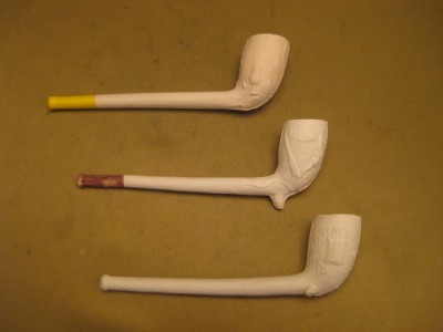 three vintage style collectable unused clay pipes