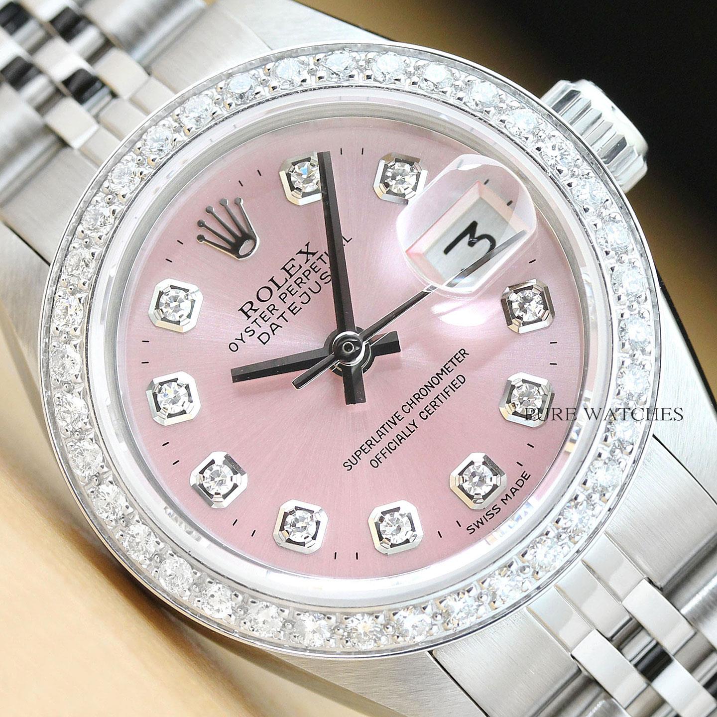 silver and pink rolex