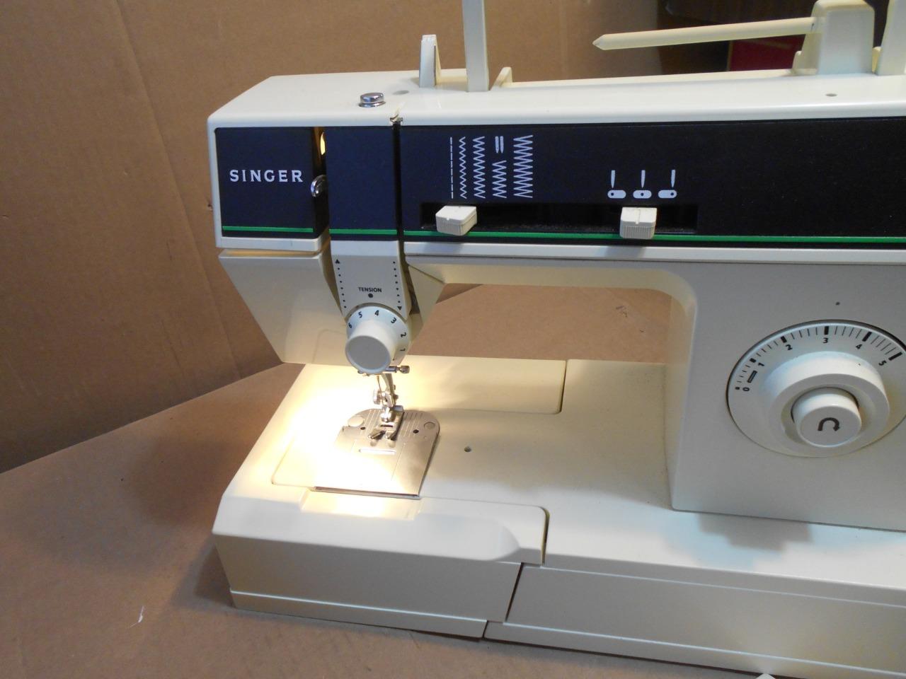 Singer 7011 Sewing Machine W/ Foot Pedal and Accessories eBay