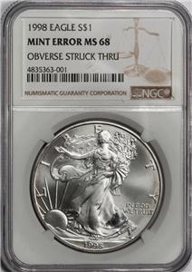 1998 NGC MS68 Large Struck Thru & Retained Plastic Silver Dollar