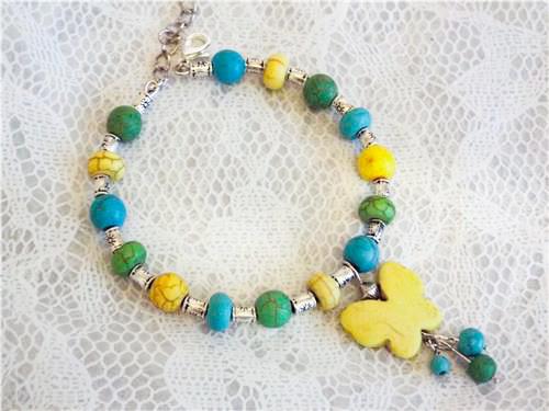 BRACCIALE CYNTHIA LYNN "COLORI VOLANTI" COLORATO HOWLITE PERLINE FARFALLA 7 COLORI - Foto 8 di 8