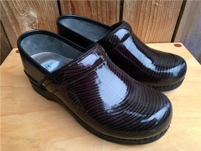 dansko black patent leather clogs